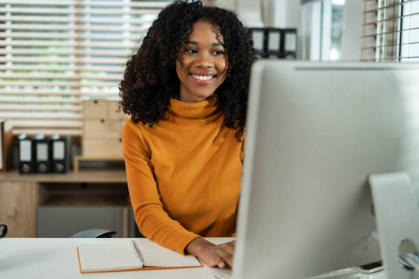 istock Businesswomen hand working with tablet and laptop computer with documents on office desk in modern office. 2158832764