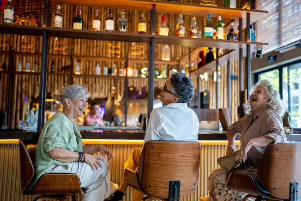 Happy female friends talking at restaurant