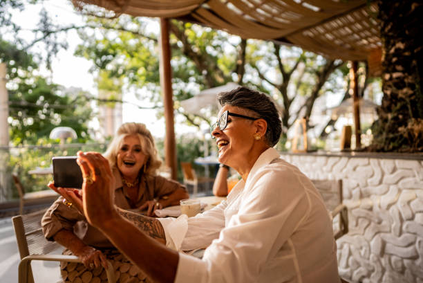 istock Female friends taking a selfie at bar or restaurant 2158834945