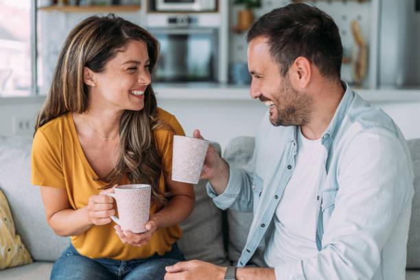 istock Lovely young couple drinking coffee at home. 2158835340