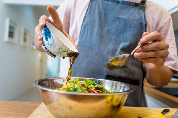 istock Chef at the kitchen preparing spicy glass noodle salad 2158838617