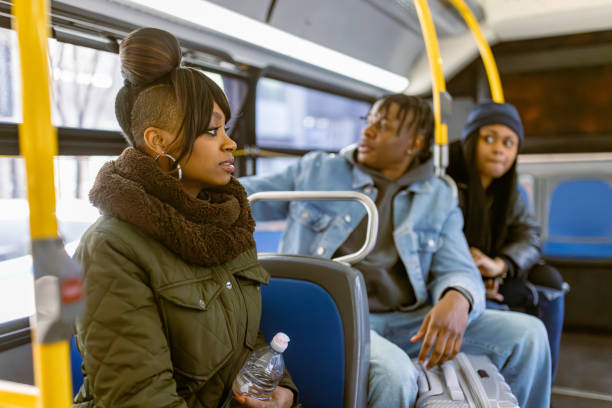 istock Commuters in Winter Gear on the Morning Bus 2158839194