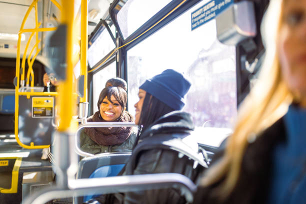 istock Morning Commute: Friends Chatting on the Bus 2158839218