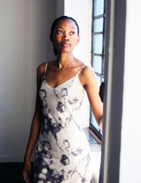 istock Radiant Reflections Black Woman at the Window 2158839946