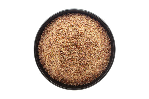 istock Organic Flaxseed (Linum usitatissimum) Flour, in a black ceramic bowl. Isolated on a white background. Top View 2158841546