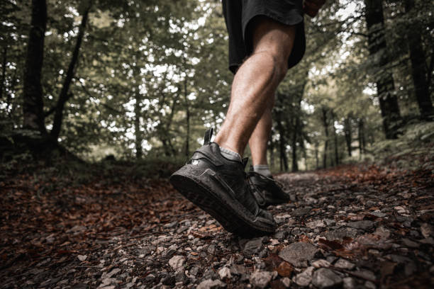 istock Close up.  Runner running on a forest trail 2158846260