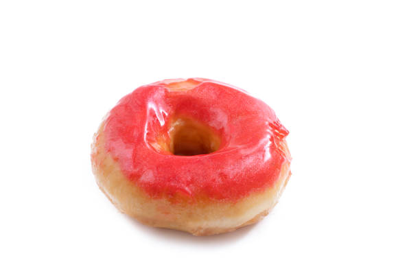 Donut with red glossy glaze isolated on white background.