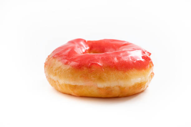 Donut with red glossy glaze isolated on white background.