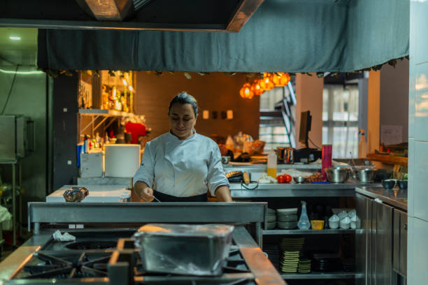 istock Beautiful woman cooking 2158849830