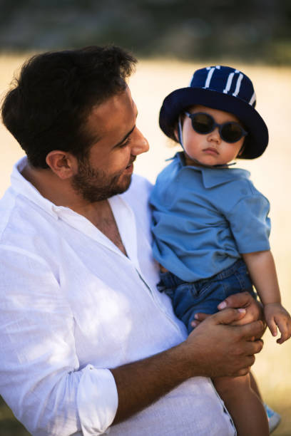 istock A father holding his one year old son 2158853703