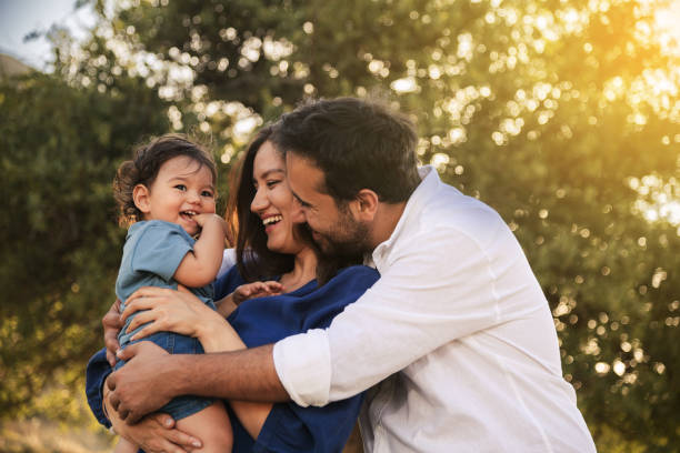 istock Happy Family Embracing in Nature 2158853763
