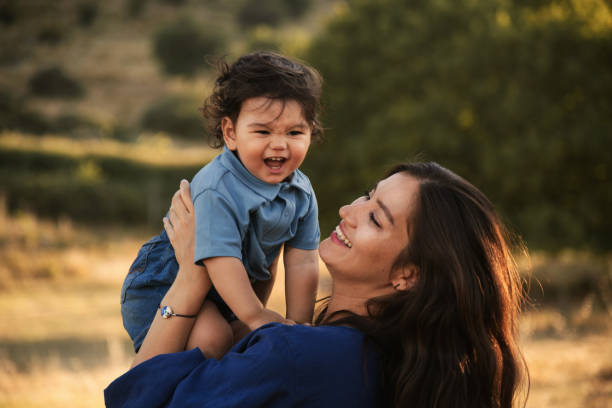 istock Mother and Son Enjoying a Sunny Day in Nature 2158853785