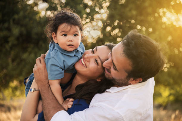 istock Happy Family Embracing in Nature 2158853799