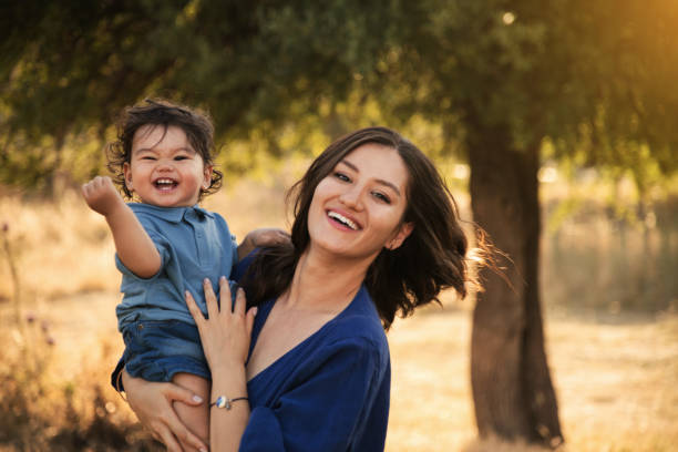 istock Mother and Son Enjoying a Sunny Day in Nature 2158853811