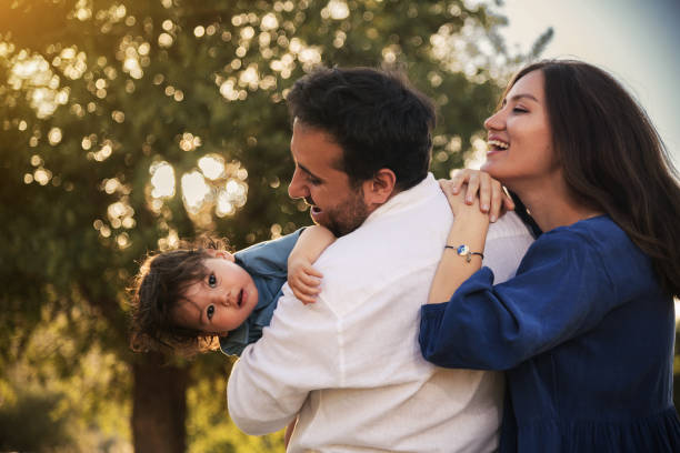 istock Happy Family Embracing in Nature 2158853813