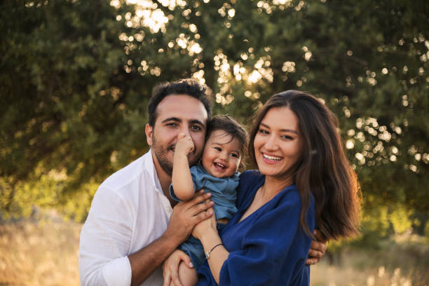 istock Happy Family Embracing in Nature 2158853832