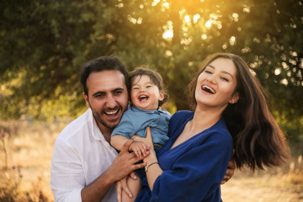 istock Happy Family Embracing in Nature 2158853833