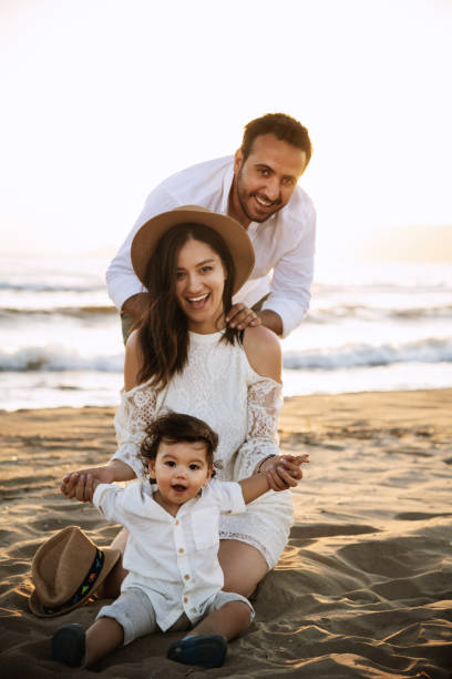 Happy Family on the Beach at Sunset