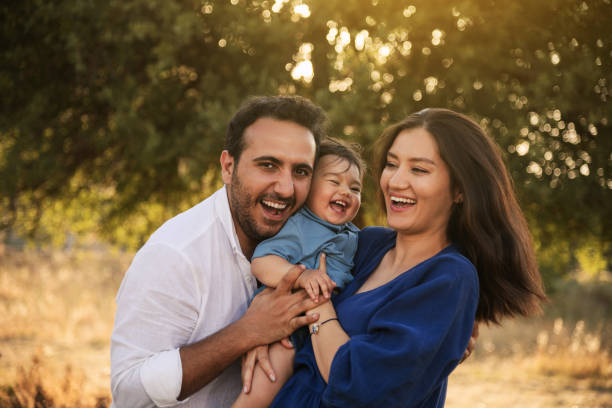 istock Happy Family Embracing in Nature 2158853863