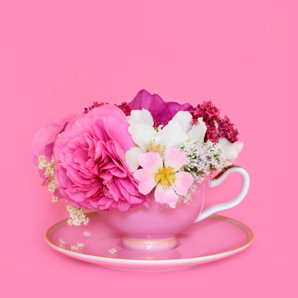 istock Summer Flower Arrangement in Pink Tea Cup for Herbal Tea 2158855554