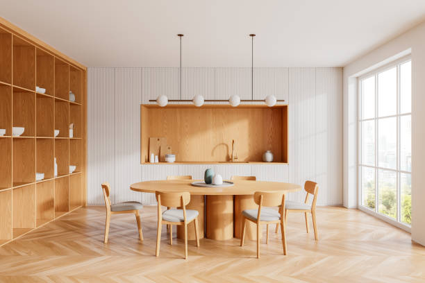 istock Wooden home kitchen interior with dinner table, cooking cabinet and window 2158856366