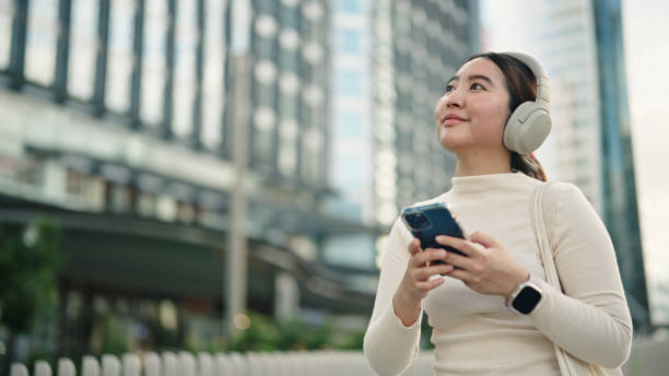 istock Businesswoman using smartphone in the city. 2158856530