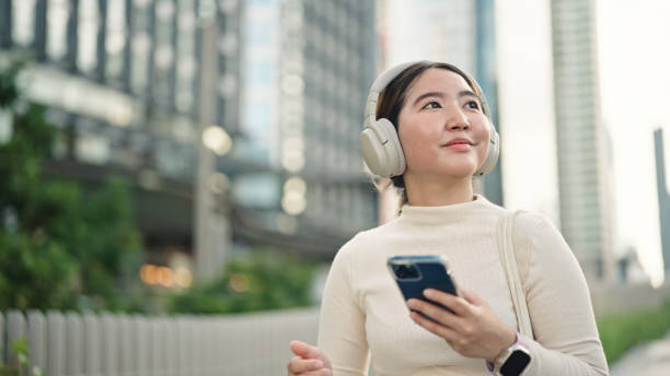istock Businesswoman using smartphone in the city. 2158856546