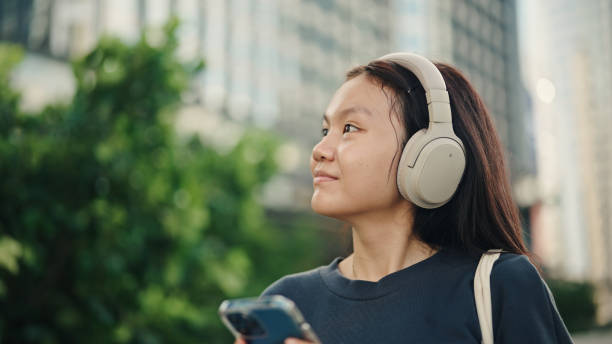 istock Teenager using smartphone in the city. 2158856684