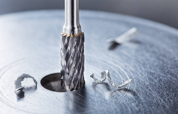 istock Milling cutter make sink in hole in steel billet. Locksmith work. 2158856958