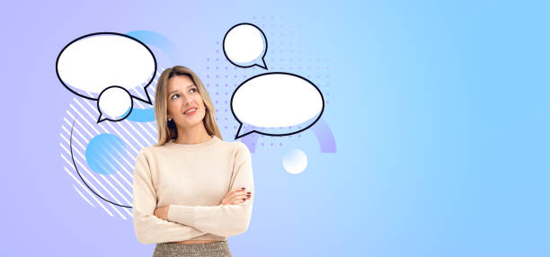 istock A woman looking up at empty speech bubbles, digital illustration 2158857210
