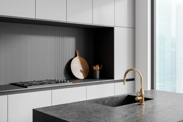 istock Modern home kitchen interior with bar island and sink, panoramic window 2158857236