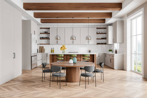 istock Luxury home kitchen interior with dinner table and bar island, panoramic window 2158857281