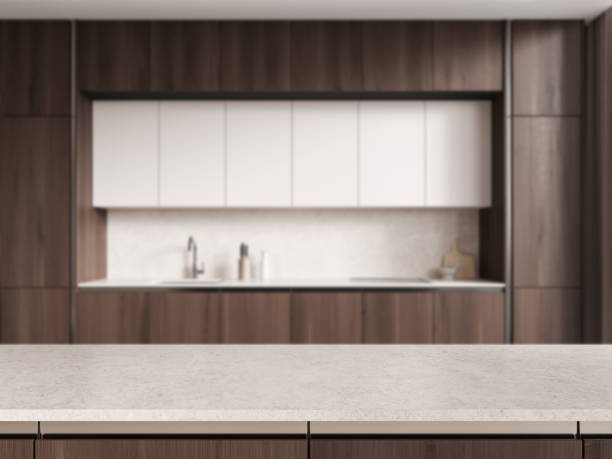 istock Stone countertop on background of kitchen interior with kitchenware. Mockup 2158857422