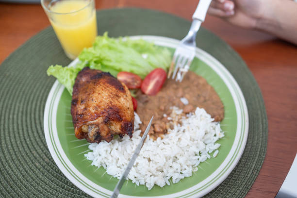 Details of Brazilian food dish, chicken with beans and rice, home-made tasty food