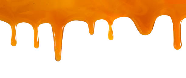 istock Golden Syrup Dripping Downwards Against A White Background 2158858402
