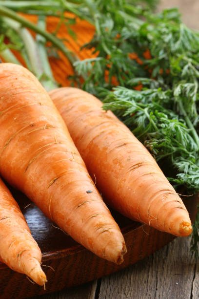 istock fresh organic carrots and carrot juice 2158858649