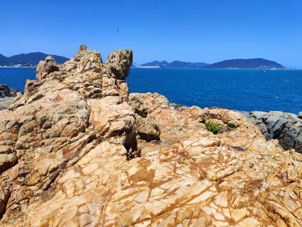 Seascape view at Cape D'Aguilar, or Hok Tsui, a cape on southeastern Hong Kong Island, Hong Kong. The peninsula, where the cape is on its southeastern side, is also known as Cape D'Aguilar. It is named after Major-General George Charles D'Aguilar.