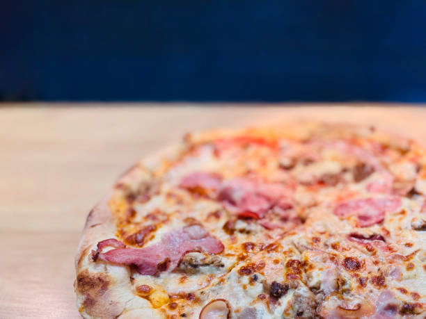 istock Crispy Pizza with Meat Toppings, Freshly Baked and Sliced 2158865407