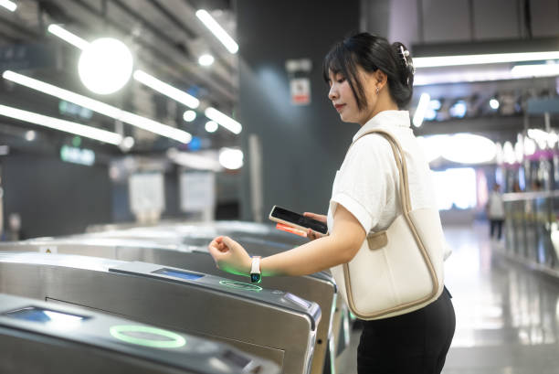 istock check in at subway with smart watch 2158865984