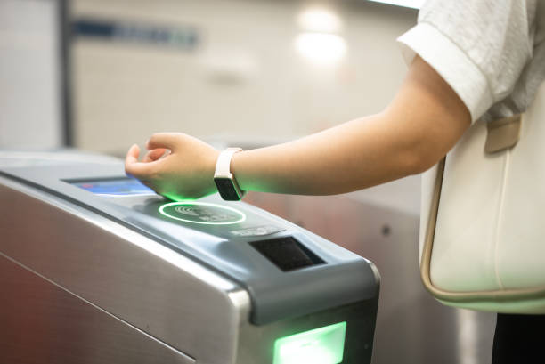 istock check in at subway with smart watch 2158865998