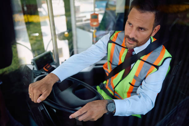 istock Mid adult man working as bus driver. 2158867277