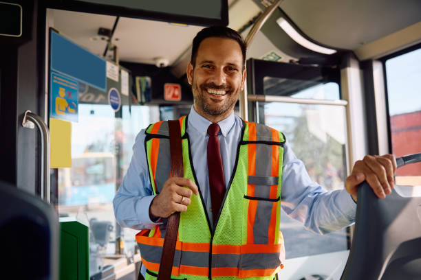 istock Happy driver inside of city bus looking at camera. 2158867350