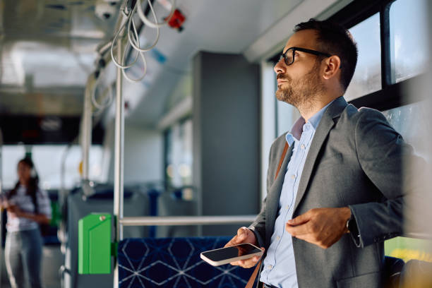 istock Pensive businessman commuting to work in public transport. 2158867455