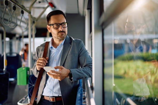 istock Pensive entrepreneur looking through the window while riding in a bus. 2158867460