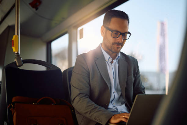 istock Male entrepreneur using laptop while riding in a bus. 2158867483