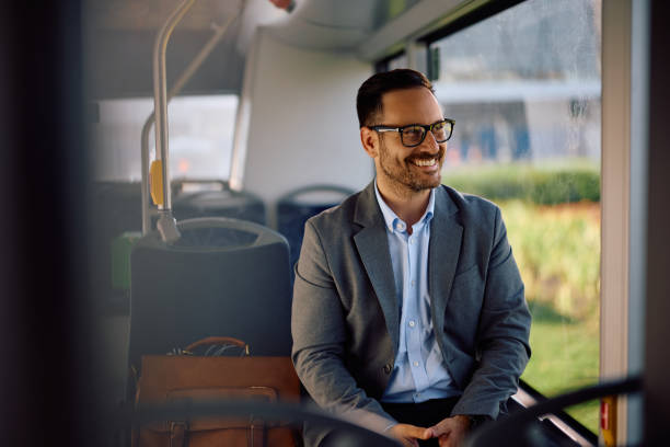 istock Happy businessman commuting by bus. 2158867489