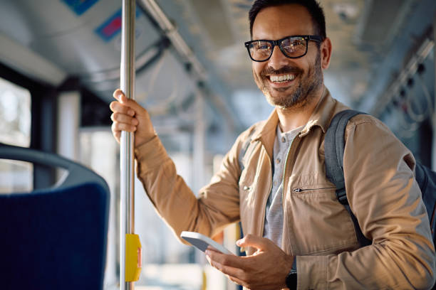 istock Happy man riding in a bus and looking at camera. 2158867656