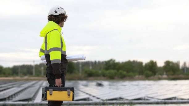 istock Smart solar engineers hold toolbox and blueprints working at Floating Solar farms, sustainable green renewable energy, Zero Carbon Credit 2158868191