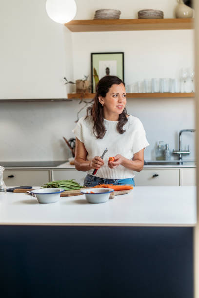 istock Woman cooking at home 2158869333