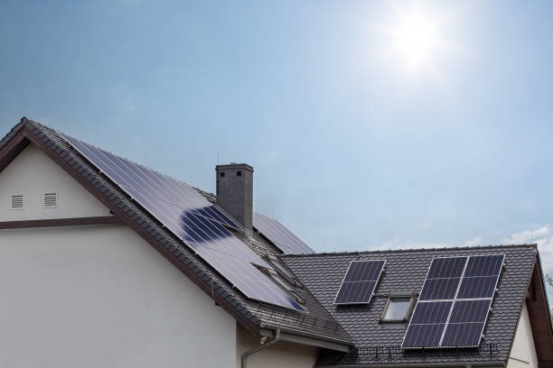 istock Solar Panels on Modern Residential Roof 2158870679